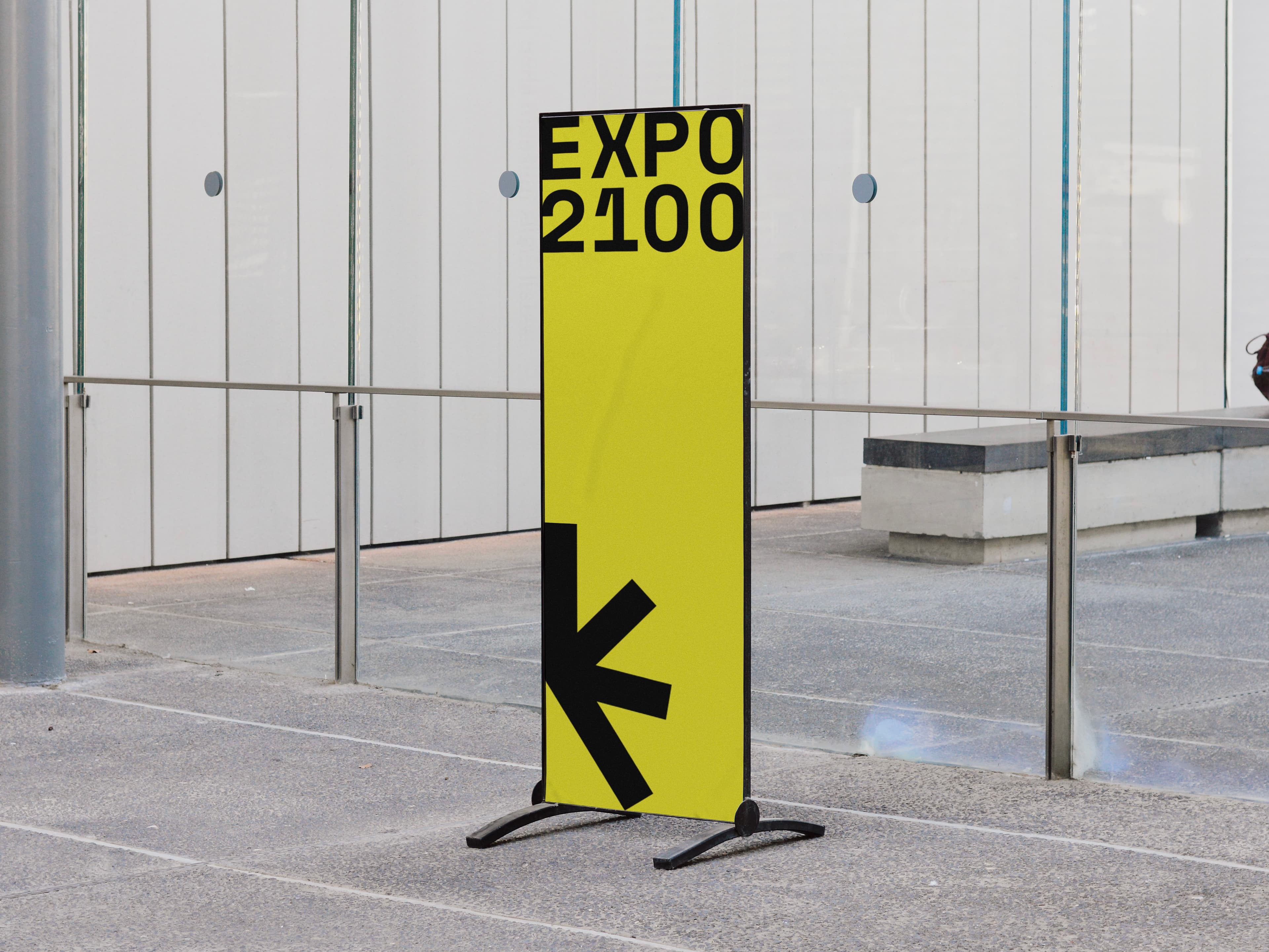 A banner displaying the Expo2100 logo on a yellow backdrop